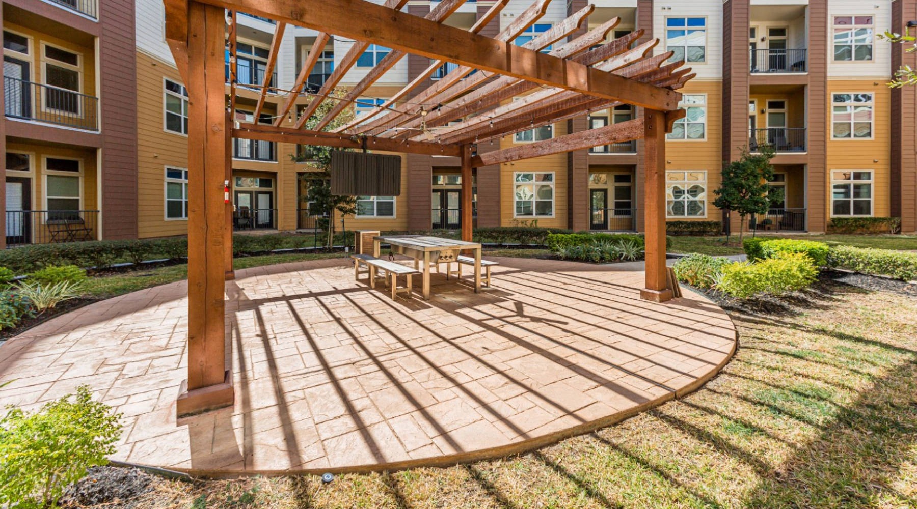 a covered patio  with a table