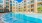 a swimming pool in front of a building