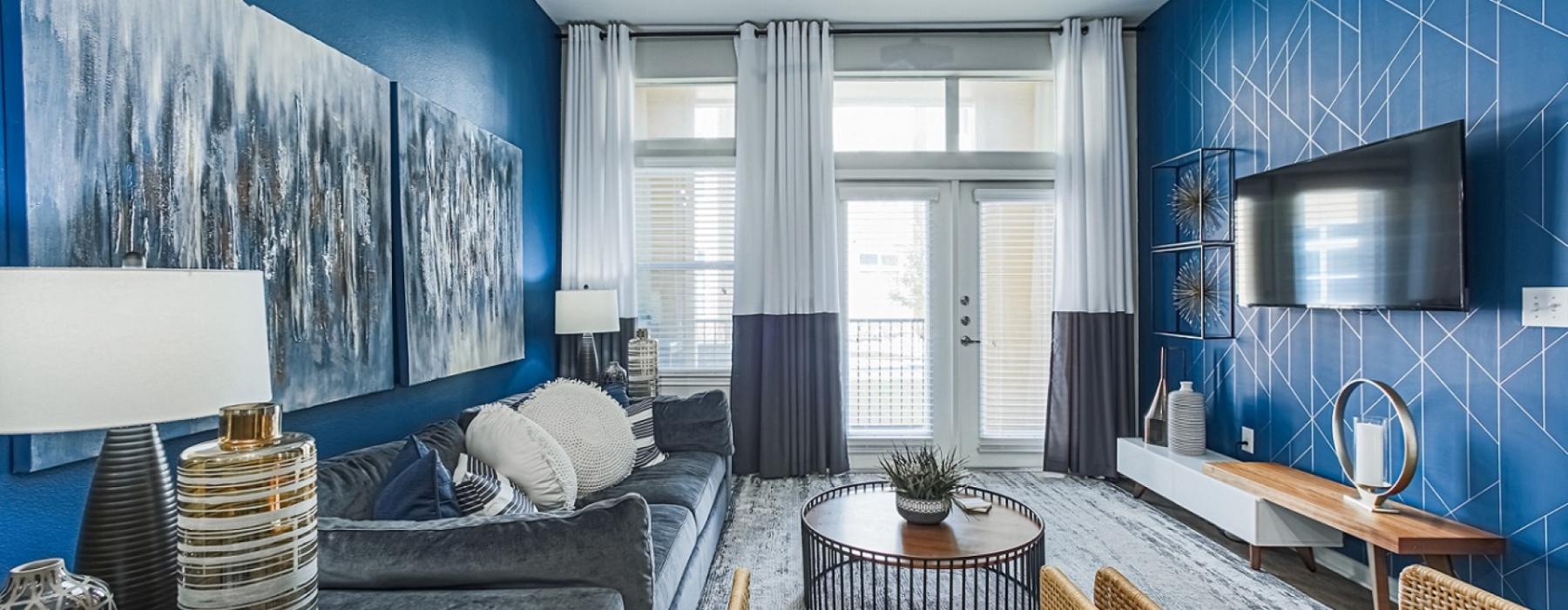 a living room with a blue wall