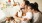 a man and woman holding a dog